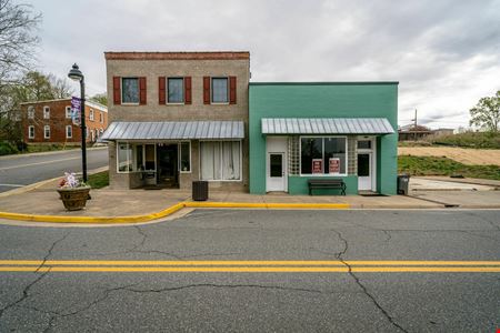 INVESTMENT OPPORTUNITY | OCCUPIED MIXED-USE BUILDINGS + 0.51 ACRES