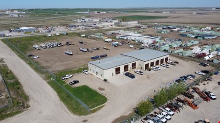 ±14,000 SF Industrial Shop | ±6.63 Fenced Yard | Williston ND