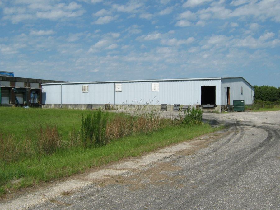 Former Talon Zipper Manufacturing/Warehouse - 105,251 SF - Adjacent to Runway with Potential IOS Land - 20 +/- Acres - Opportunity Zone