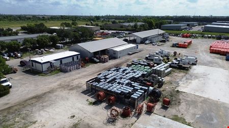 4.62 AC of Fully Fenced Industrial Land with Covered Storage