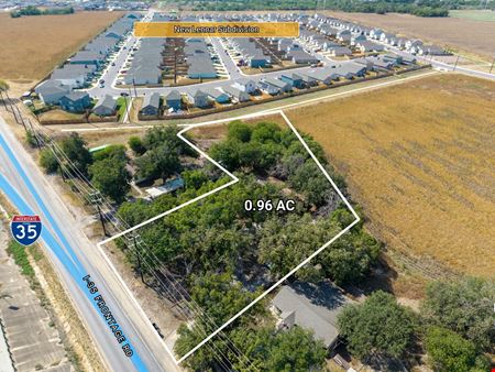 0.96 AC on I-35 South Frontage, Zoned C-3R / I-1, 1,960 SF Building