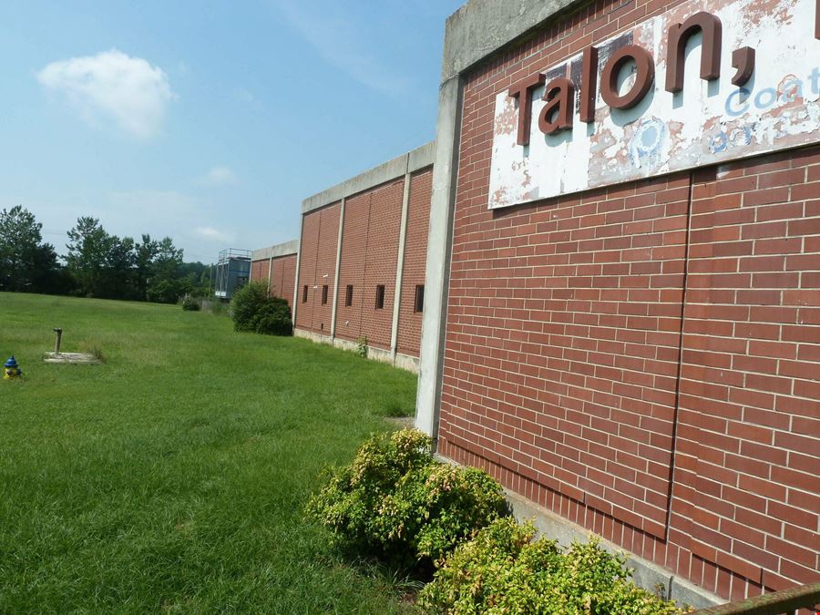 Former Talon Zipper Manufacturing/Warehouse - 105,251 SF - Adjacent to Runway with Potential IOS Land - 20 +/- Acres - Opportunity Zone
