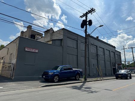 Syracuse Mixed-Use Corner Building – Retail Income + Residential Conversion