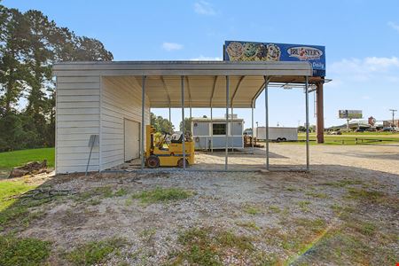 Commercial Investment & Redevelopment Opportunity | Approximately 600' of Highway 105 Frontage | Owner Financing Available