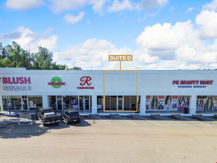 Tangi Plaza: Walmart-Shadowed Retail in a Highly-Visible Corridor