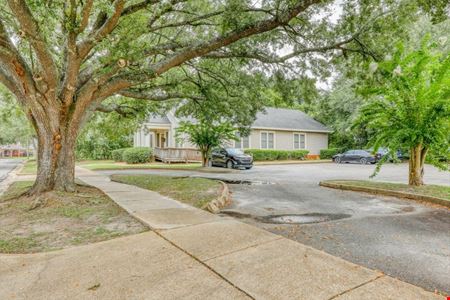 SALE OR LEASE:  Incredible commercial office building with additional development potential, a brief walk from all downtown Thomasville