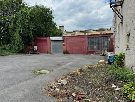 Syracuse Mixed-Use Corner Building – Retail Income + Residential Conversion